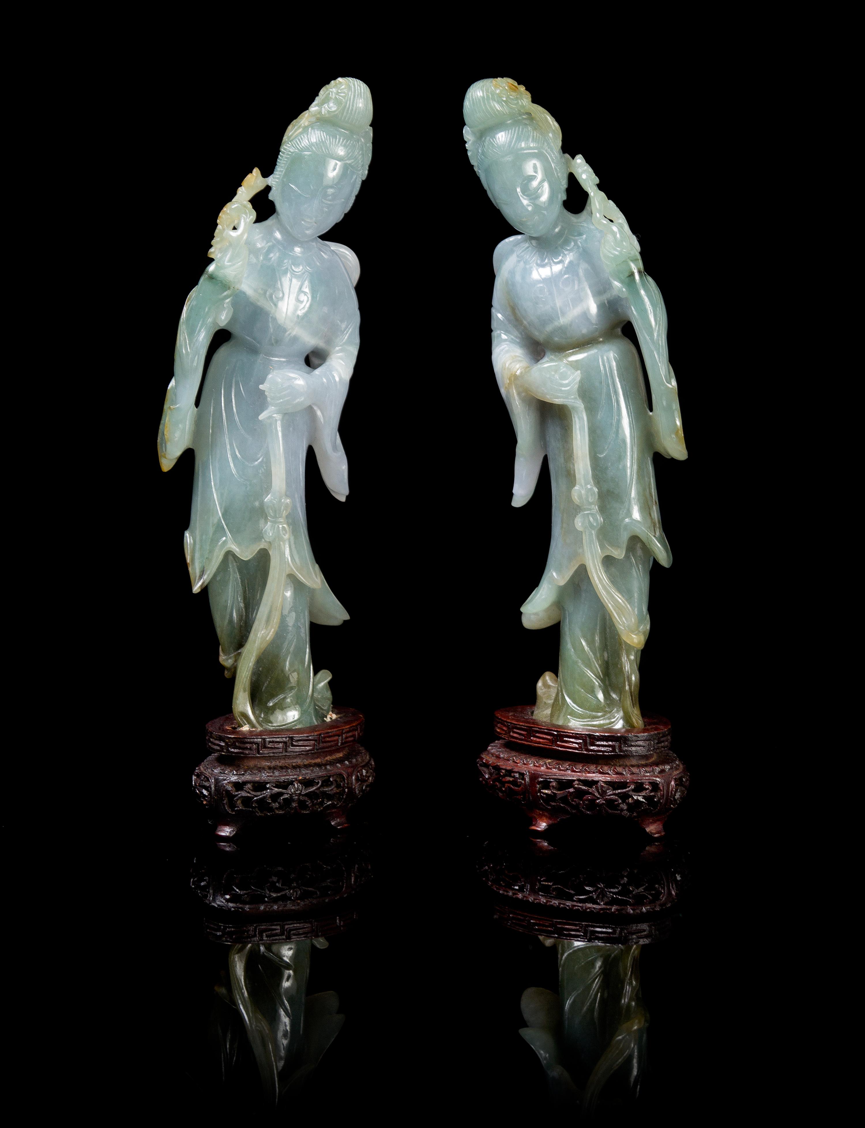 A Matched Pair of Chinese Jadeite Figures of Meirens LATE QING DYNASTY OR LATER Height 7 3/4 x width 2 1/4 inches (with stand). — LATE QING DYNASTY OR LATER