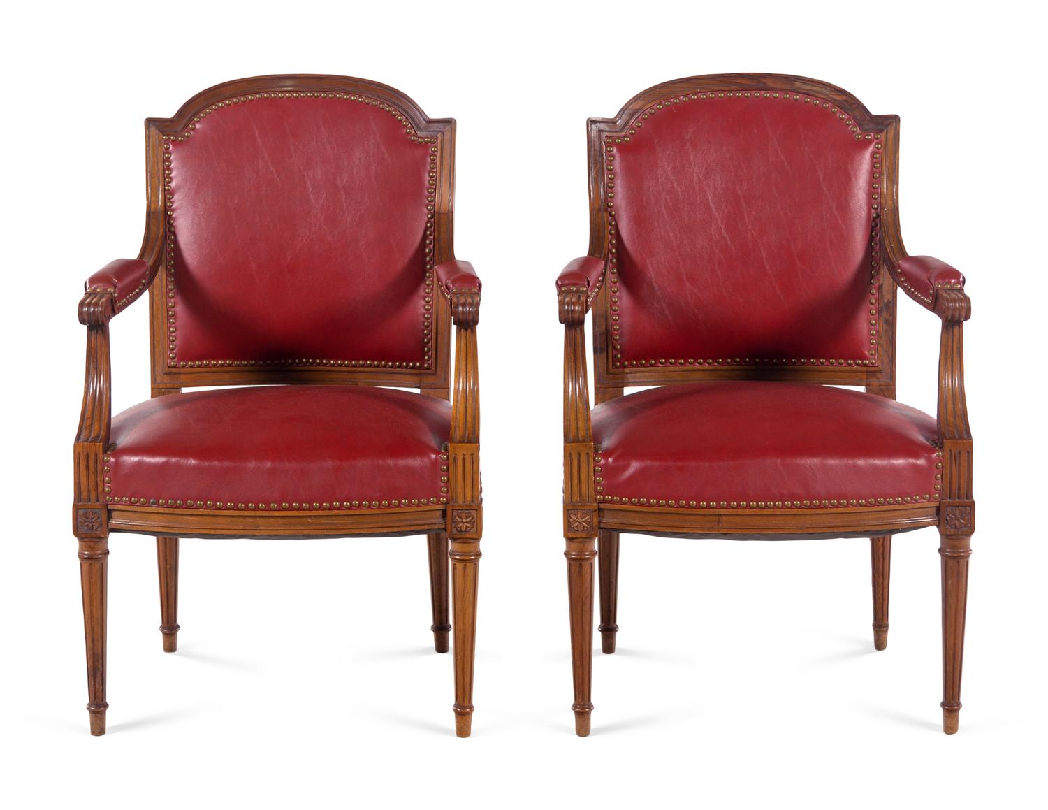 A Pair of Louis XVI Style Walnut Fauteuils