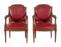 A Pair of Louis XVI Style Walnut Fauteuils