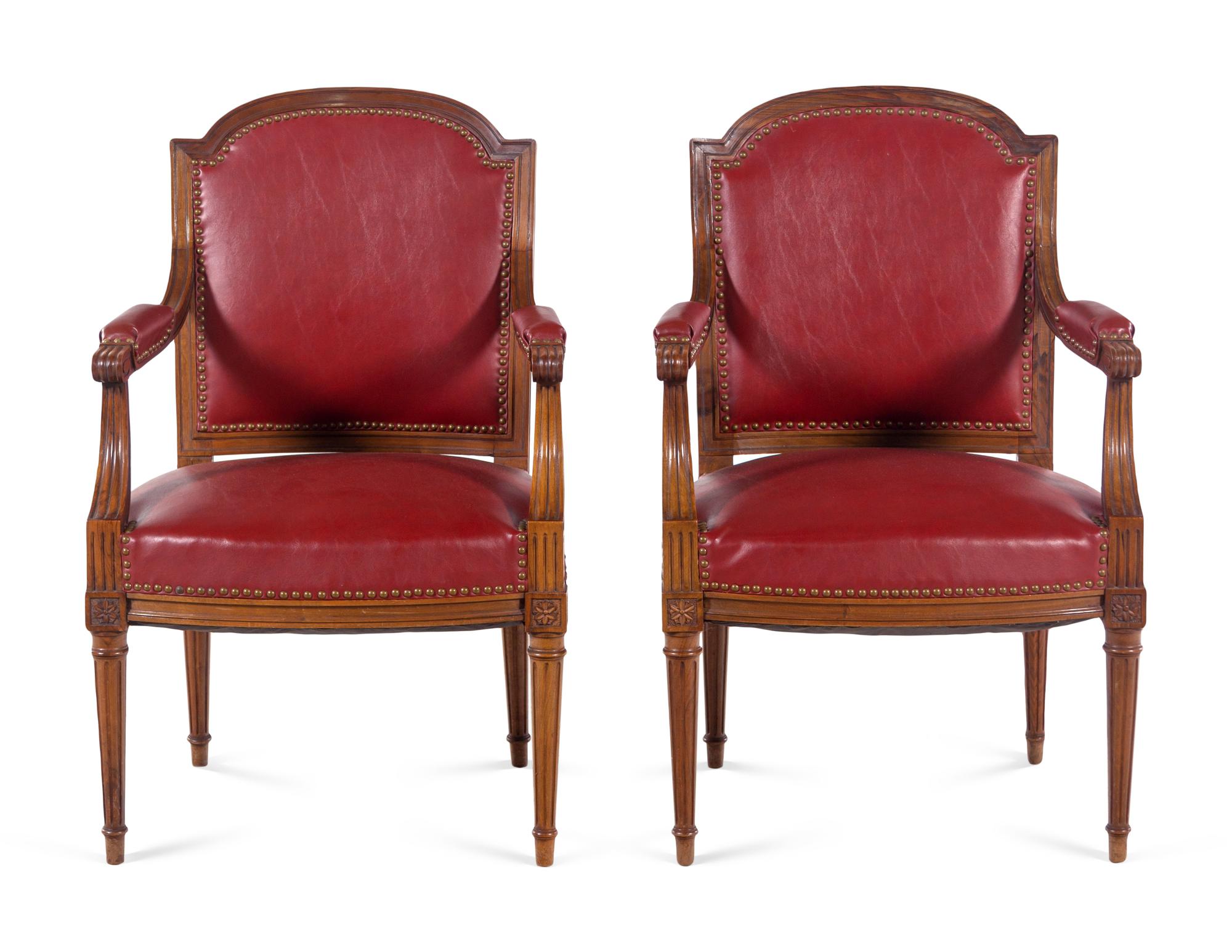 A Pair of Louis XVI Style Walnut Fauteuils