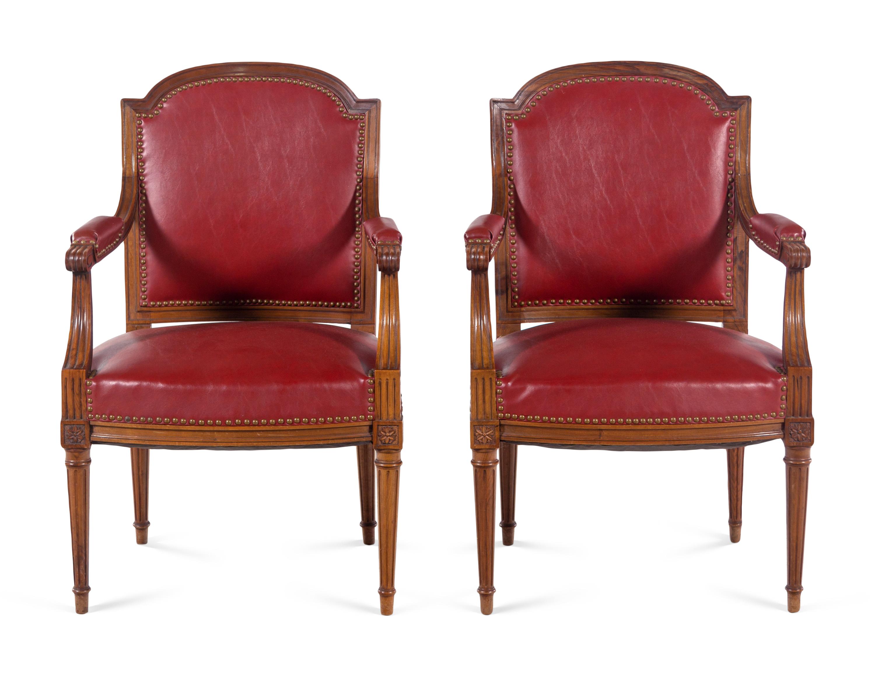 A Pair of Louis XVI Style Walnut Fauteuils