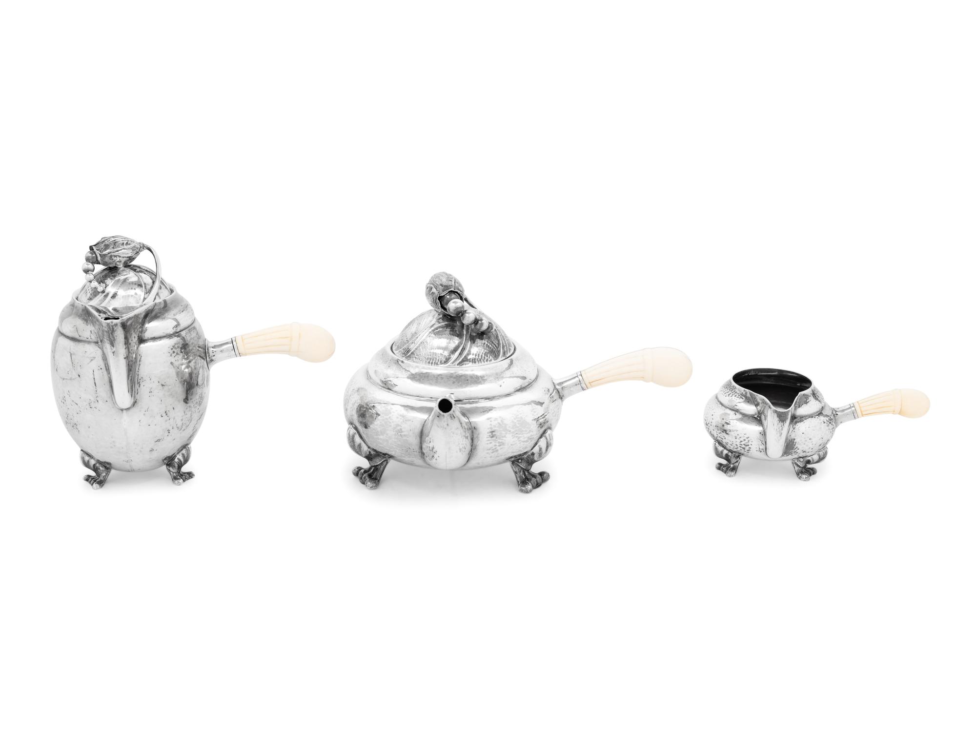 A Georg Jensen Silver Blossom Three-Piece Tea and Coffee Service