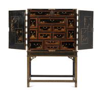 A Japanese Lacquer and Brass Mounted Cabinet on Stand
