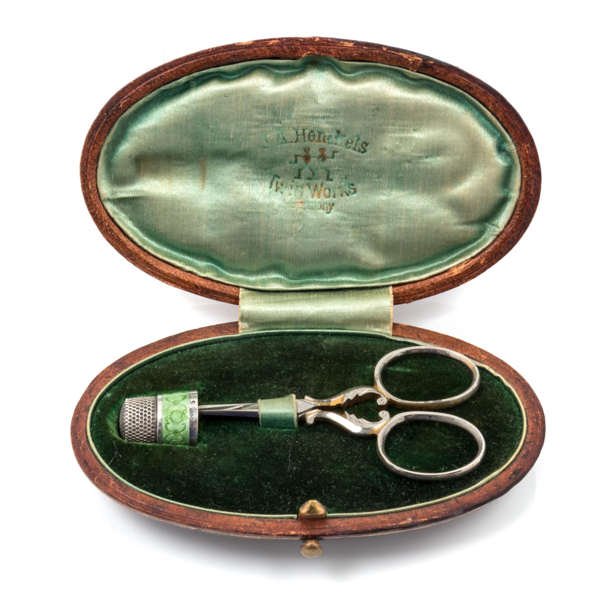 An American Silver and Guilloche Enamel Thimble and Scissor Set, Simons Bros., Philadelphia, PA, the thimble with a green guilloche ena