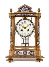 A French Gilt Bronze and Champleve Mantel Clock, Height 13 3/8 inches.