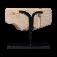 An Egyptian Limestone Relief Fragment with the Head of a Pharaoh