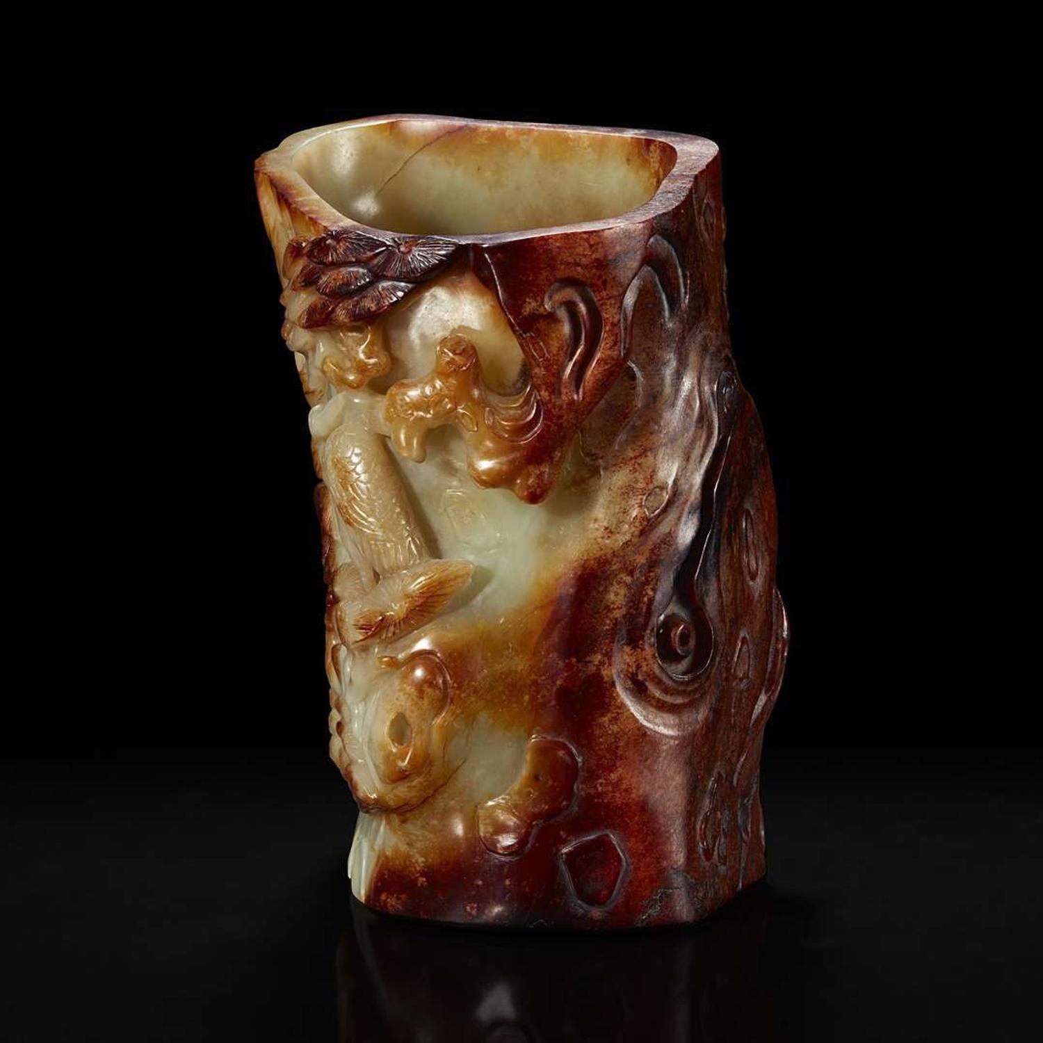A Chinese carved russet and celadon jade brush holder 青玉笔筒