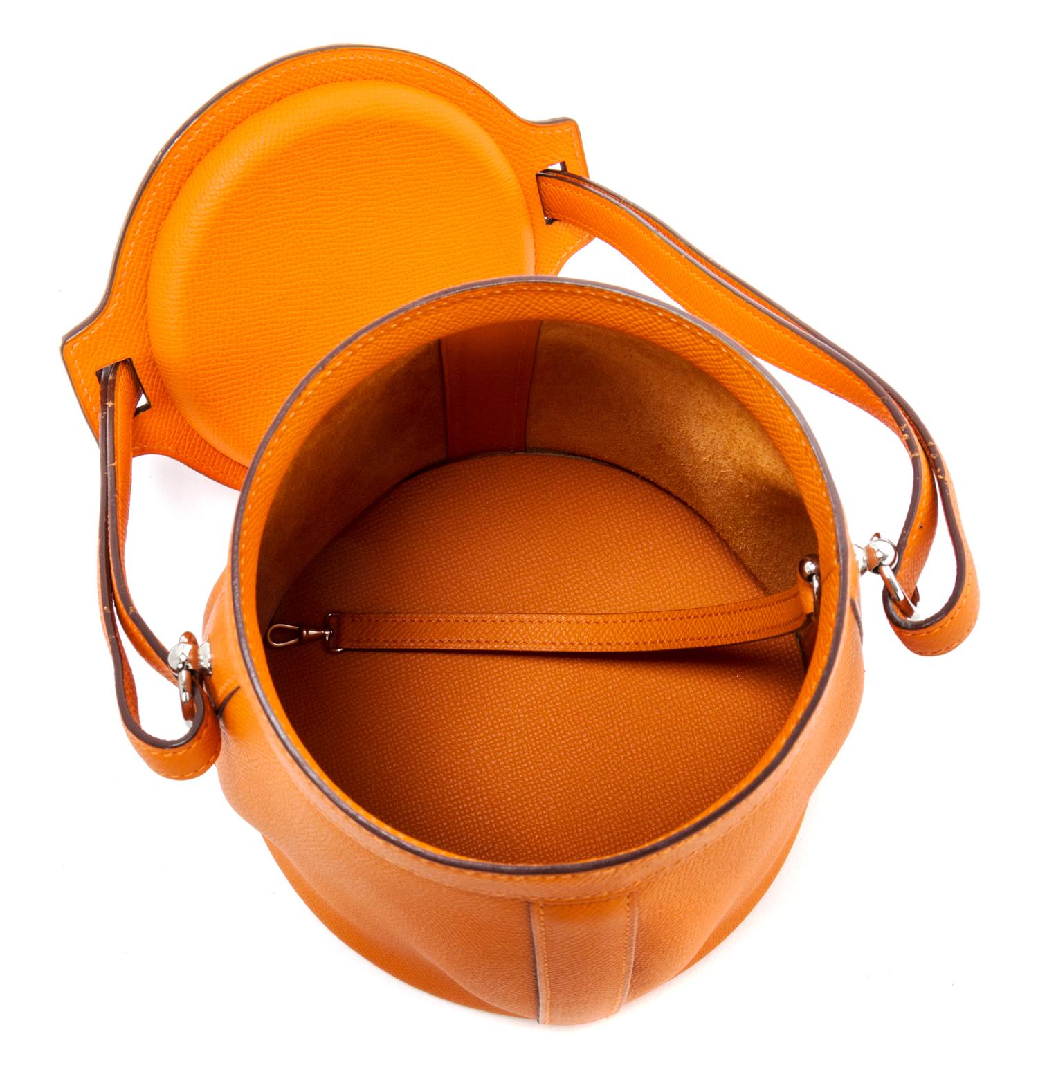 An Hermes Orange Clemence Feed Handbag, 6.75" x 7.25" x 5".