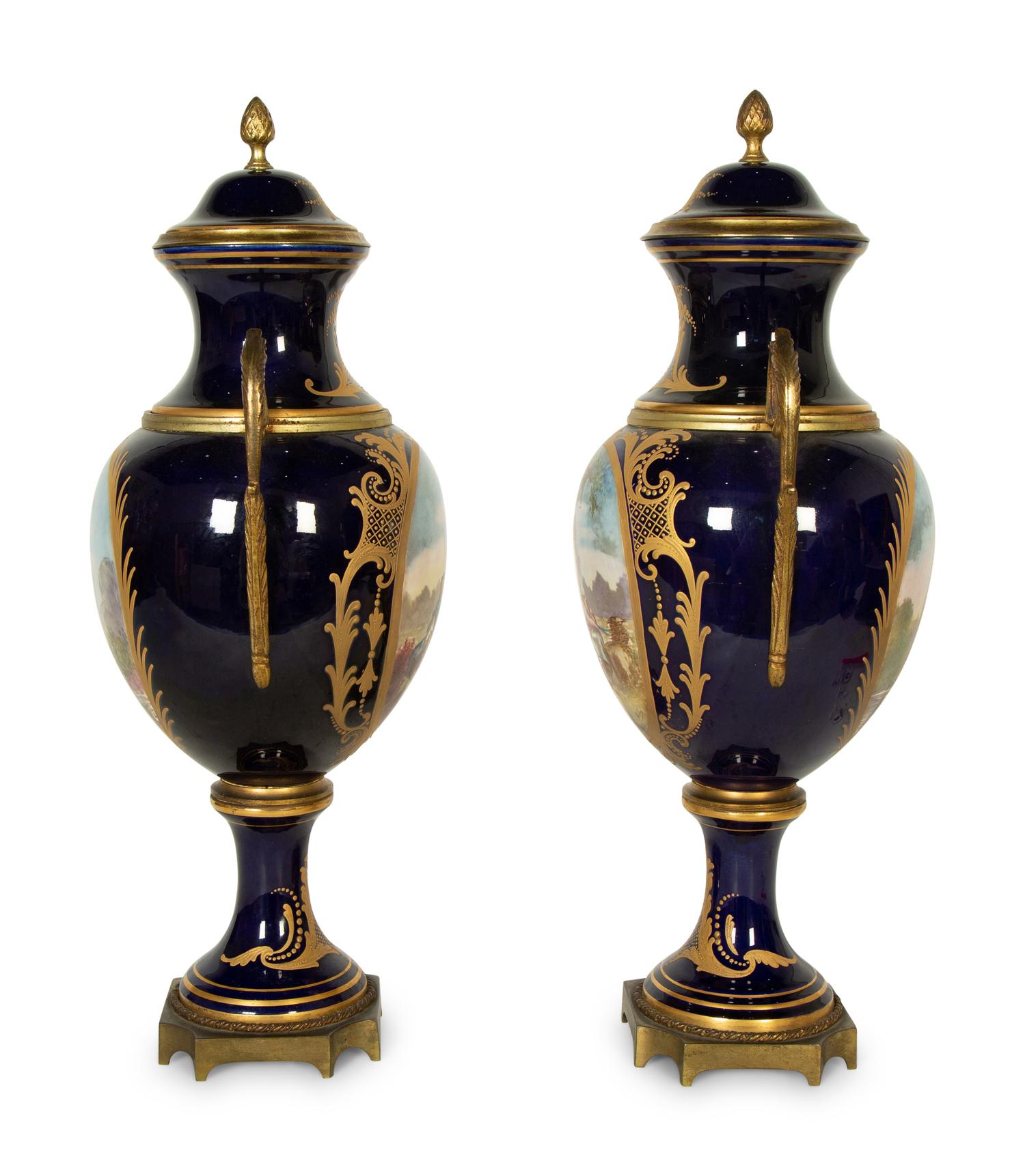 A Pair of Sèvres Style Porcelain Urns