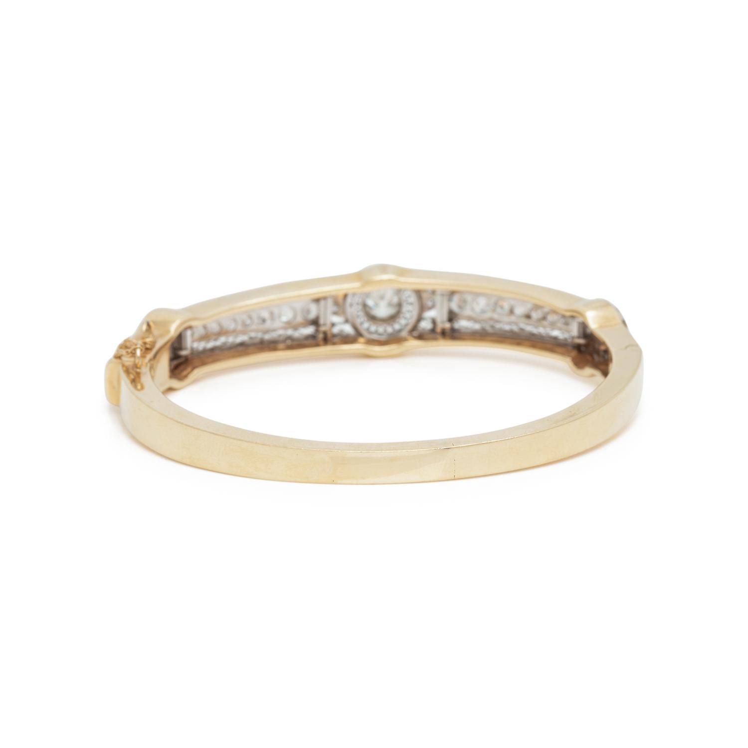 YELLOW GOLD, PLATINUM AND DIAMOND BANGLE BRACELET