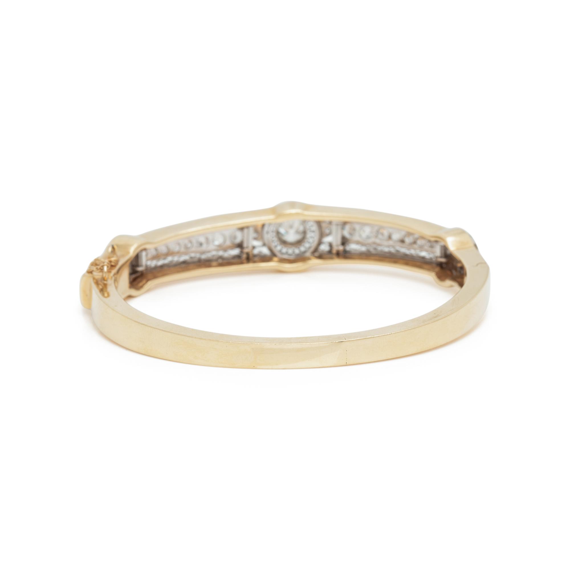 YELLOW GOLD, PLATINUM AND DIAMOND BANGLE BRACELET
