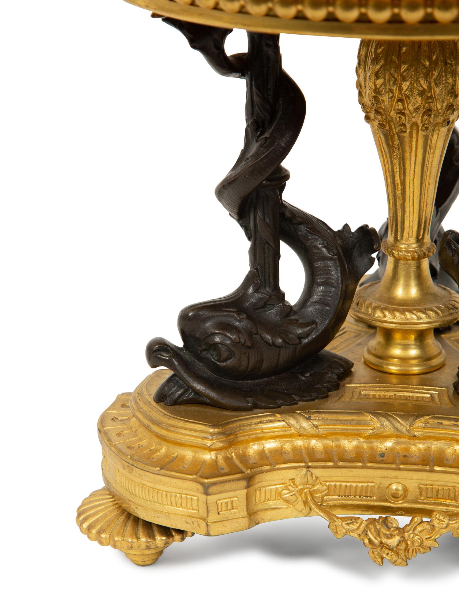 An Empire Style Patinated and Gilt Bronze Mounted Onyx Centerpiece