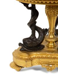 An Empire Style Patinated and Gilt Bronze Mounted Onyx Centerpiece