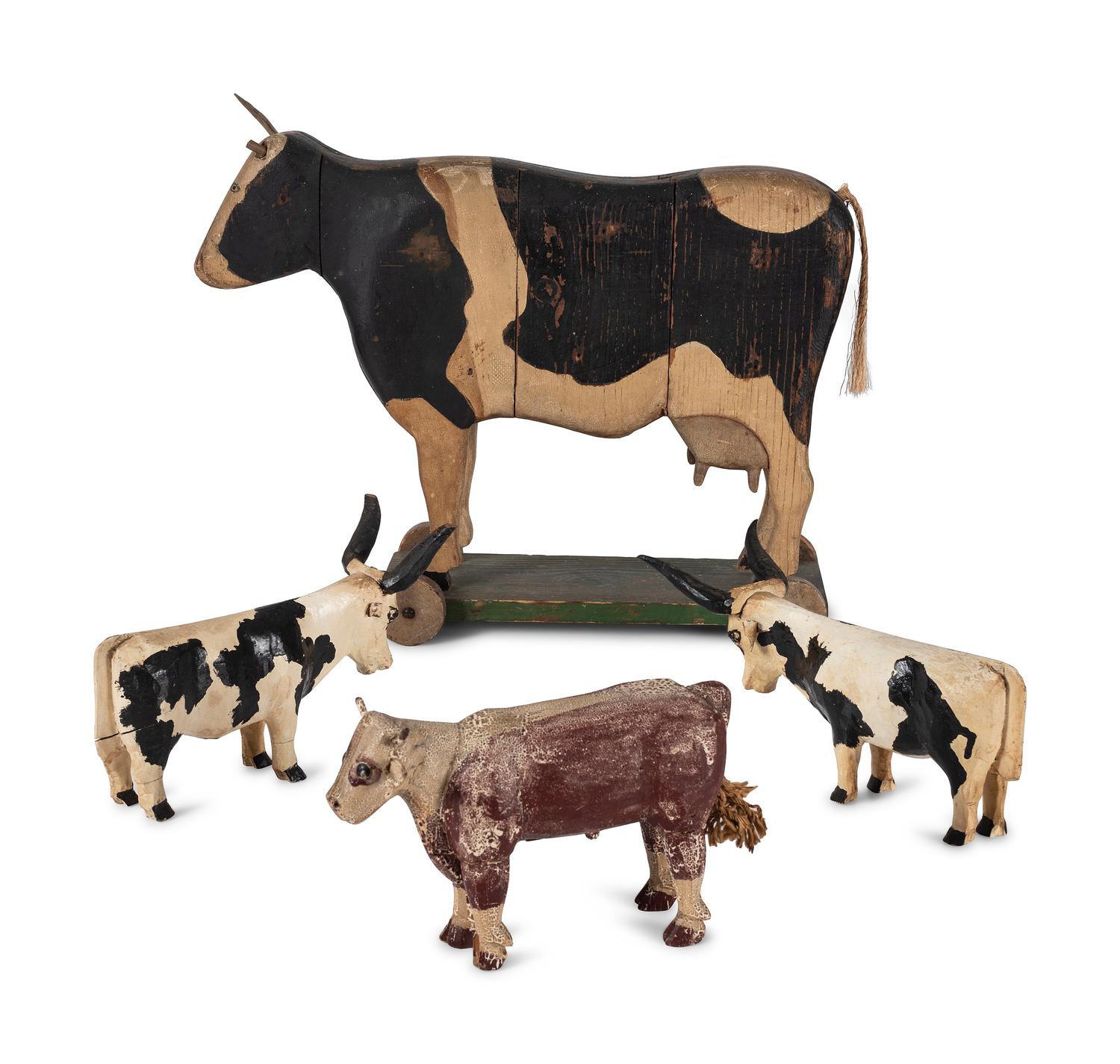 Four Carved Wood and Painted Folk Art Cows