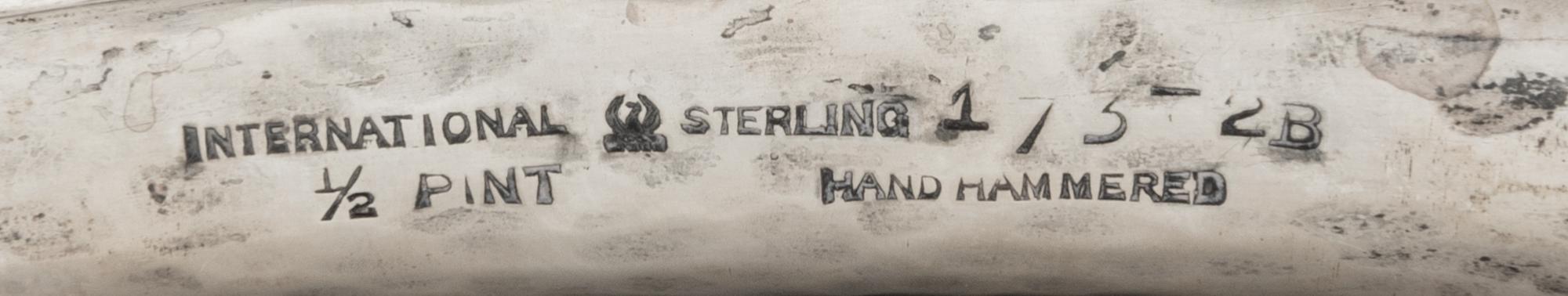 An International Hammered Silver Flask