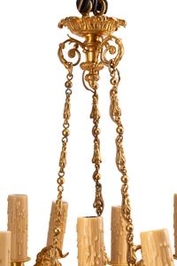 A French Neoclassical Gilt and Patinated Bronze Twelve-Light Chandelier