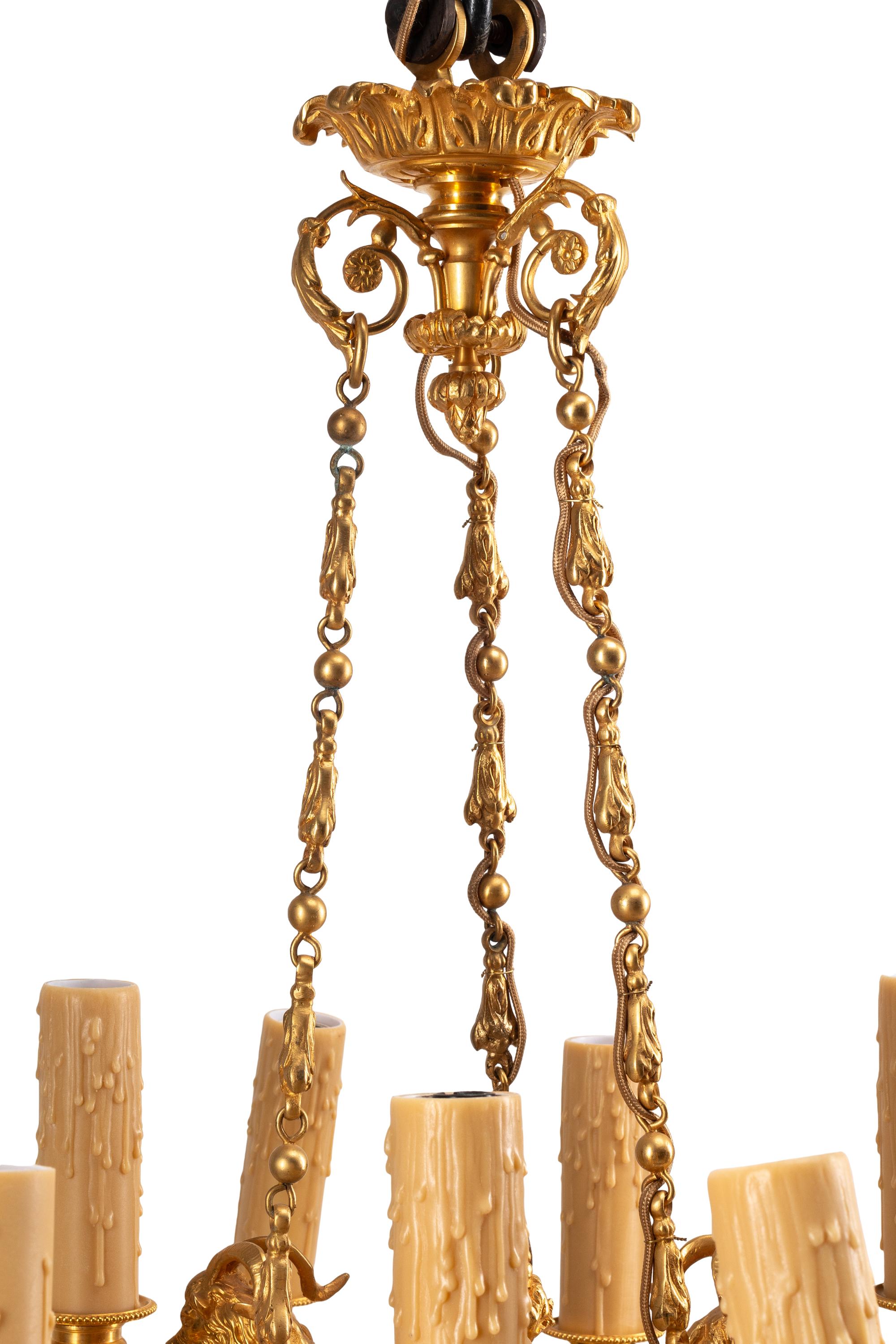 A French Neoclassical Gilt and Patinated Bronze Twelve-Light Chandelier