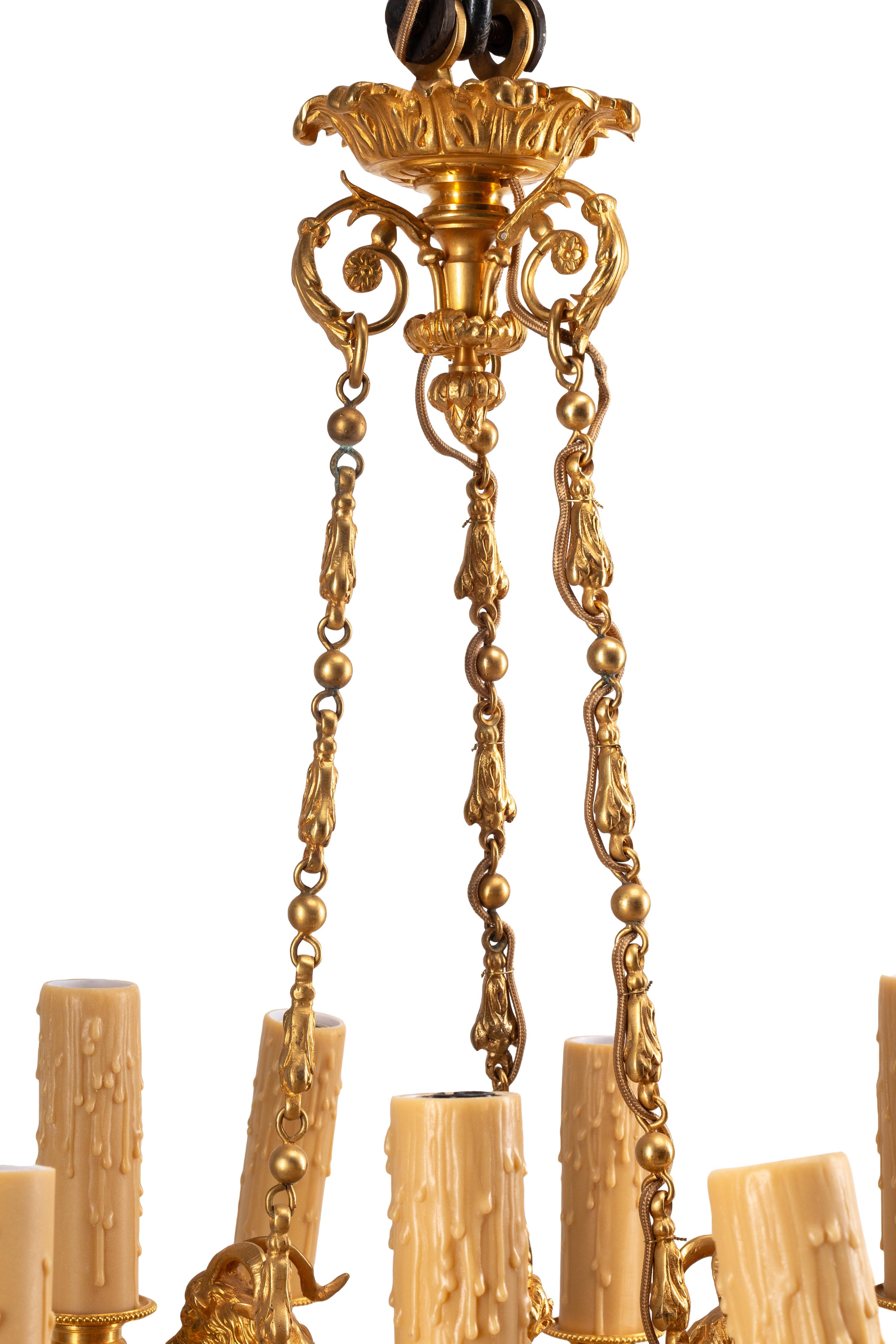 A French Neoclassical Gilt and Patinated Bronze Twelve-Light Chandelier