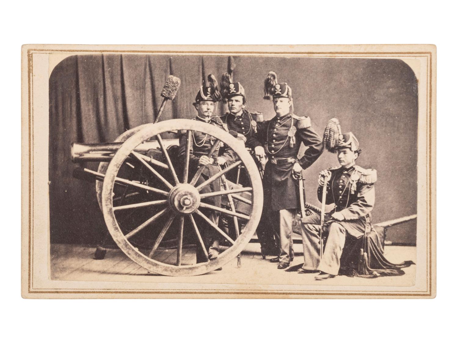 [MILITARIA - TEXAS]. DE PLANQUE, Louis (1842-1898), photographer. CDV showing a group of US artillery officers in dress uniforms with a brass 12-pound gun. Brownsville, TX.