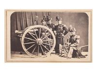 [MILITARIA - TEXAS]. DE PLANQUE, Louis (1842-1898), photographer. CDV showing a group of US artillery officers in dress uniforms with a brass 12-pound gun. Brownsville, TX.