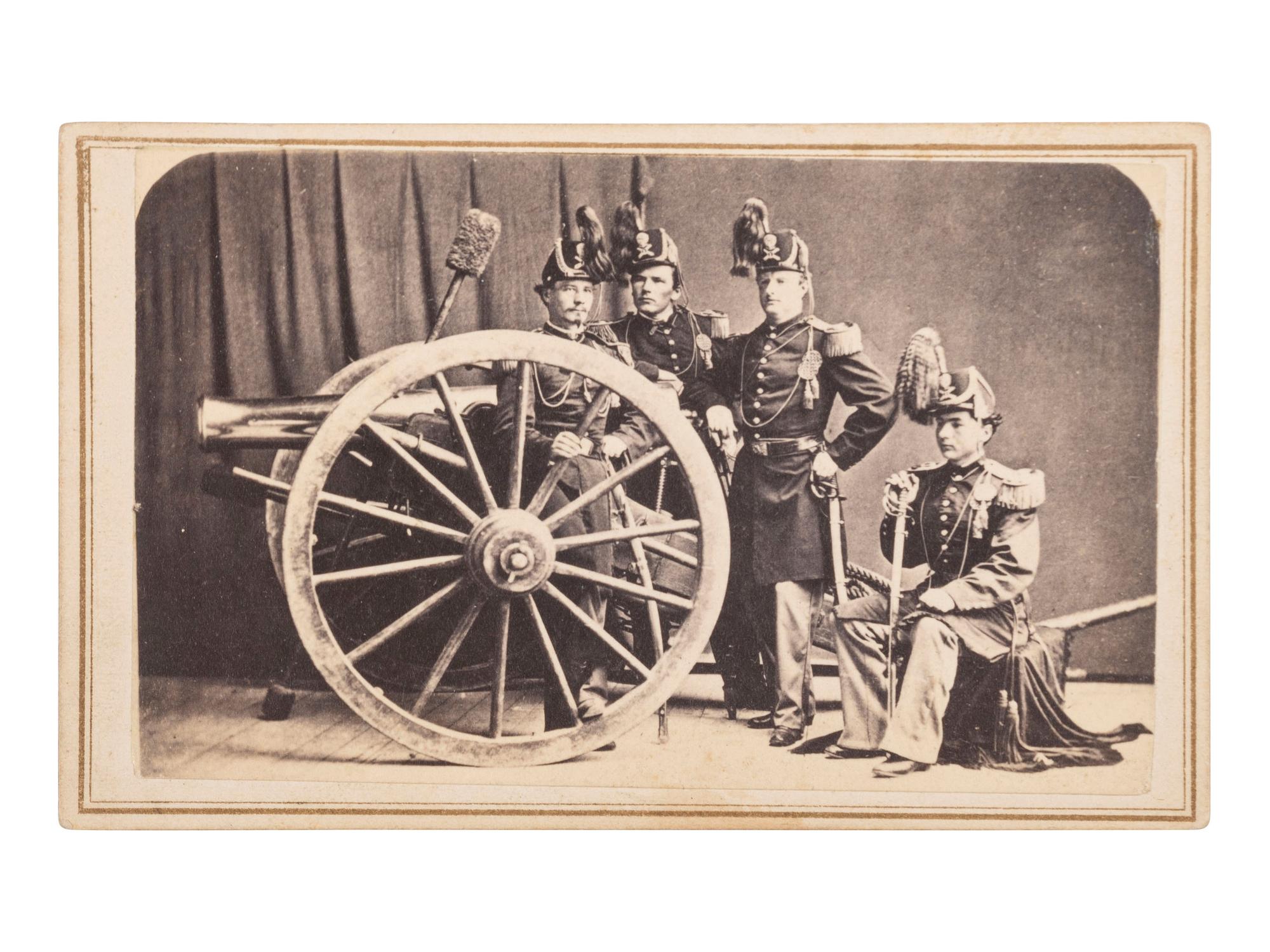 [MILITARIA - TEXAS]. DE PLANQUE, Louis (1842-1898), photographer. CDV showing a group of US artillery officers in dress uniforms with a brass 12-pound gun. Brownsville, TX.