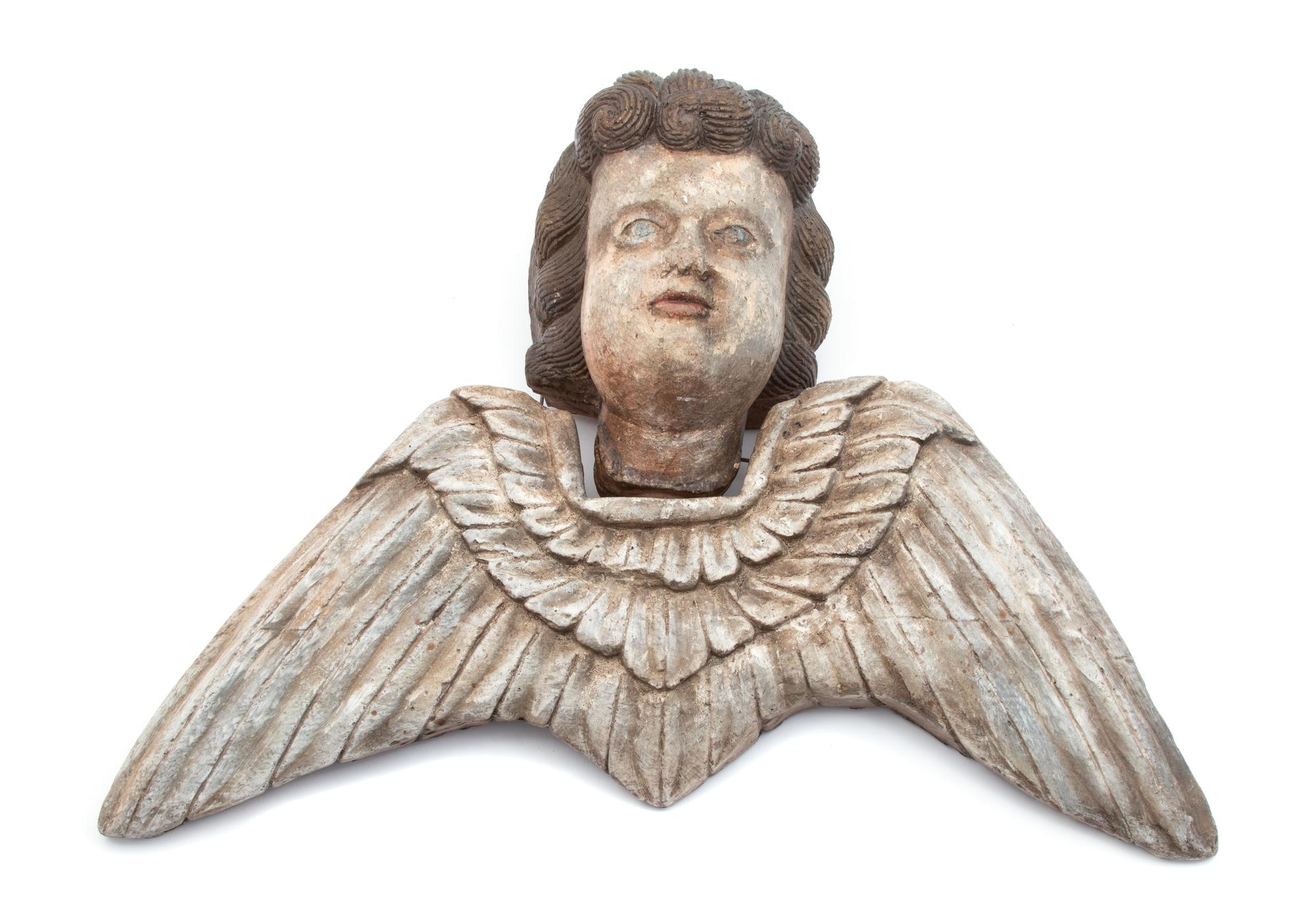 An Italian Painted Terracotta Winged Putti Head Height 13 x width 18 inches. — 19TH CENTURY