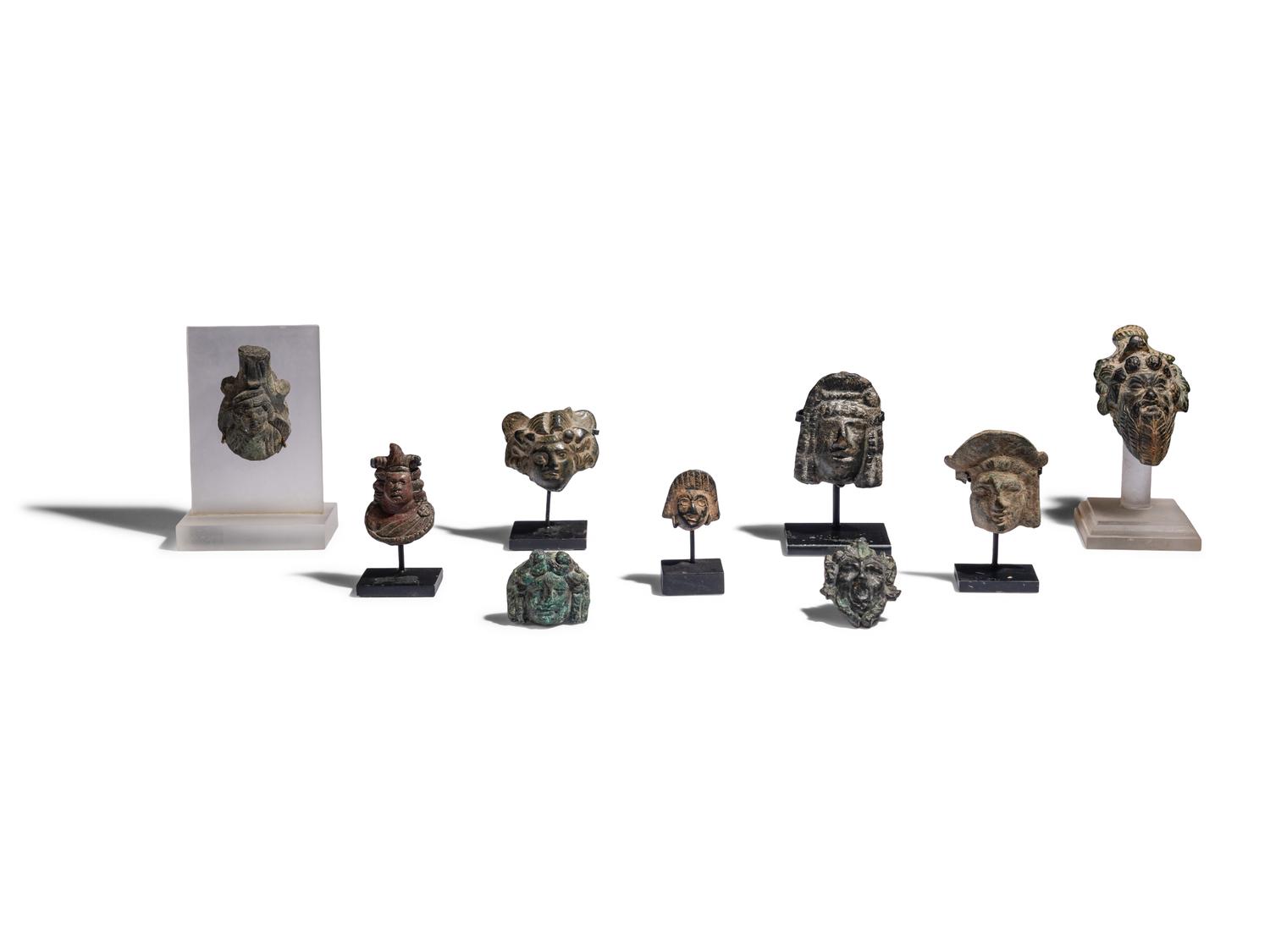 Nine Roman Bronze Masks