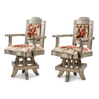 A Pair of Anglo-Colonial Silvered Metal-Clad Swiveling Armchairs