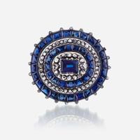 A sapphire, diamond, and silver topped eighteen karat gold brooch