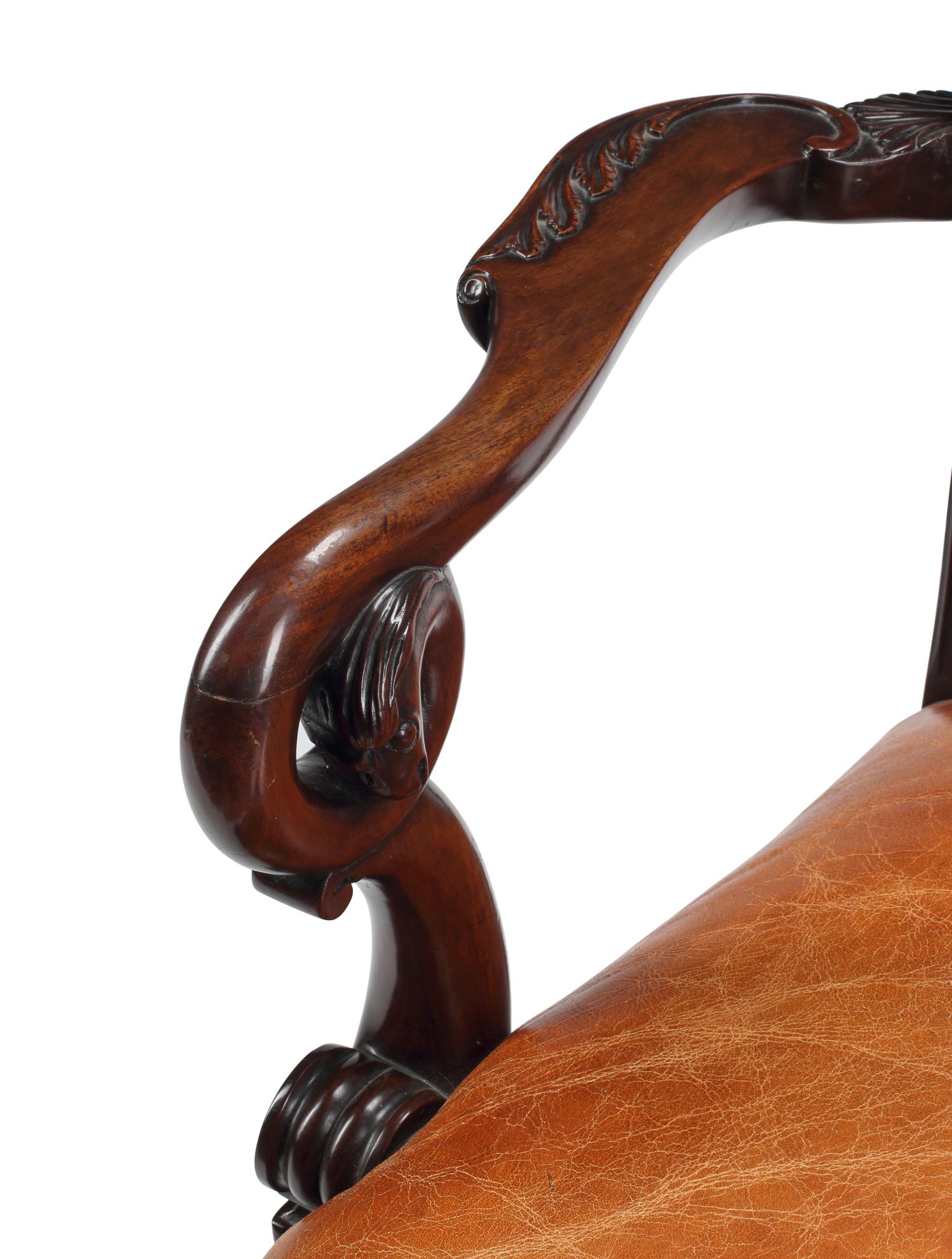 An English Carved Mahogany Leather-Upholstered Armchair