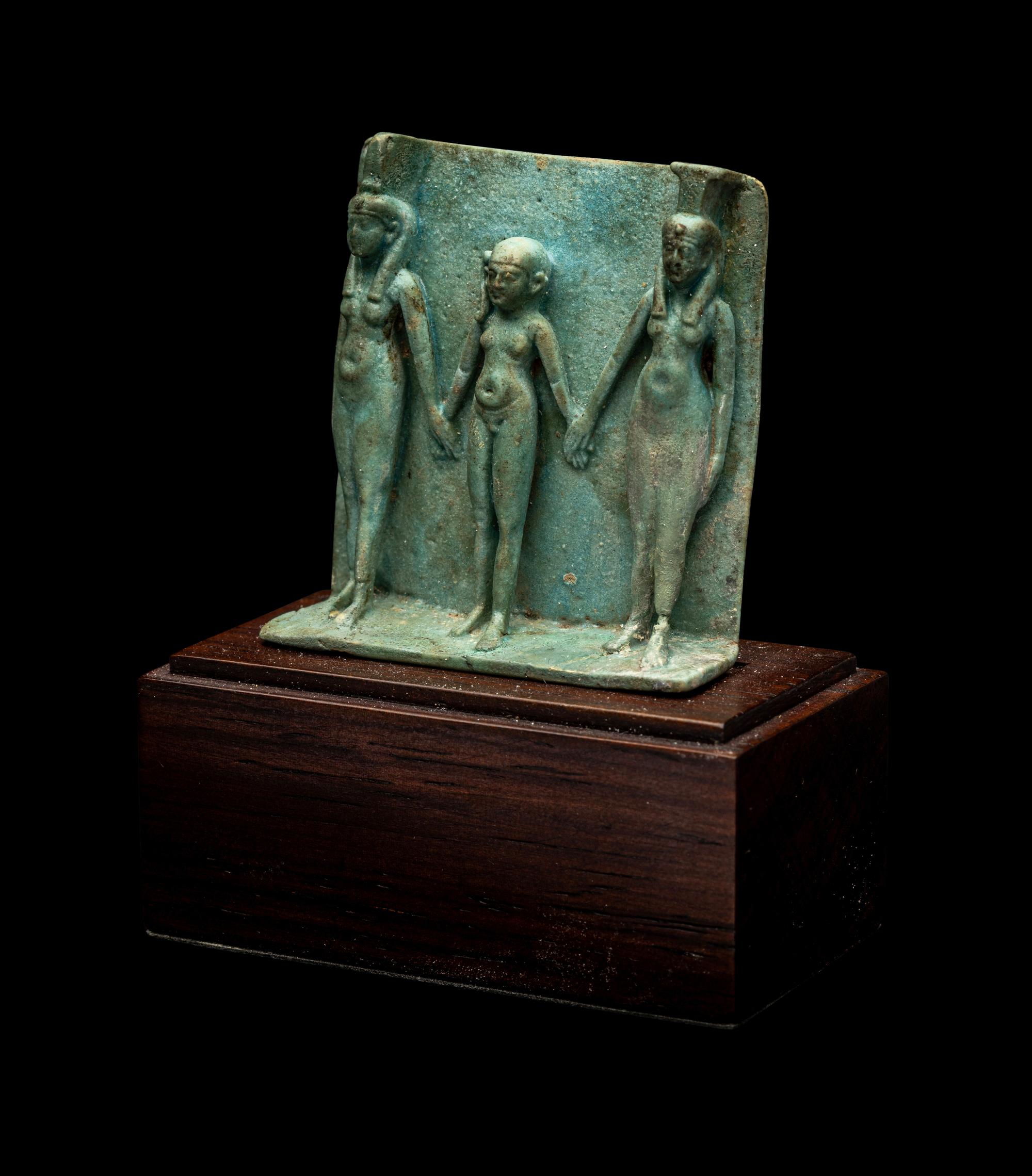 An Egyptian Faience Triad Amulet