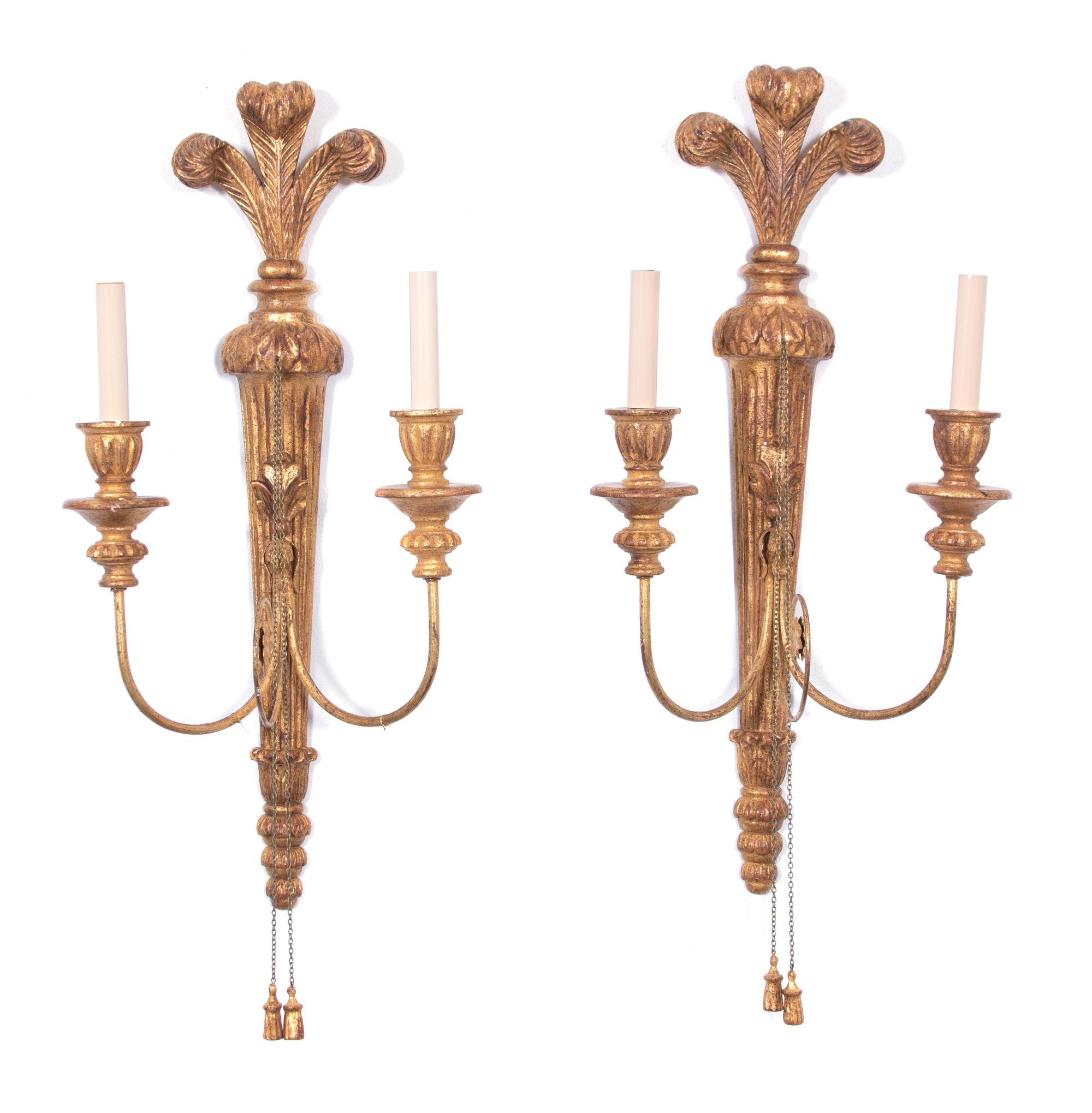 A Pair of Italian Carved Giltwood and Metal Two-Light Wall Sconces Height 26 inches. — 20TH CENTURY