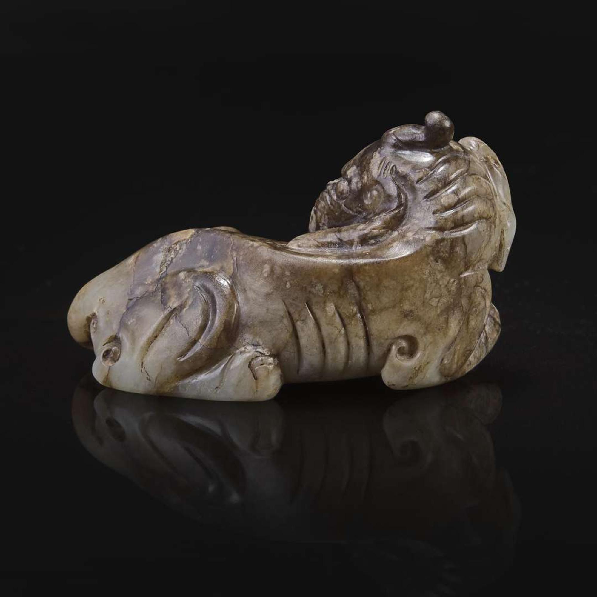 A Chinese brown and beige jade carving of a Baku 玉雕貘 Ming dynasty or earlier ????