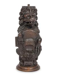 A Carved Oak Figural Newel Post