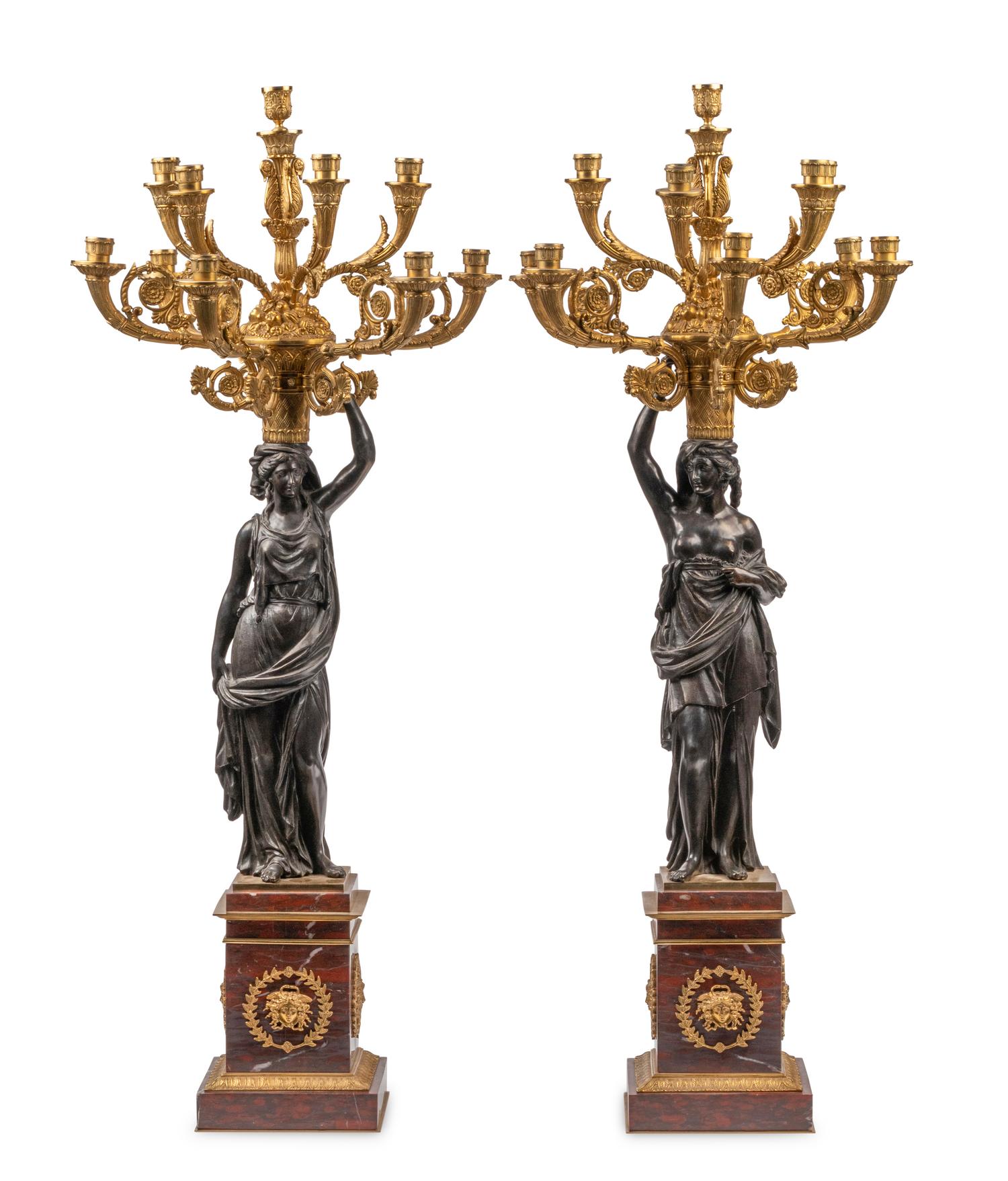 A Large French Gilt and Patinated Bronze and Rouge Marble Three-Piece Clock Garniture