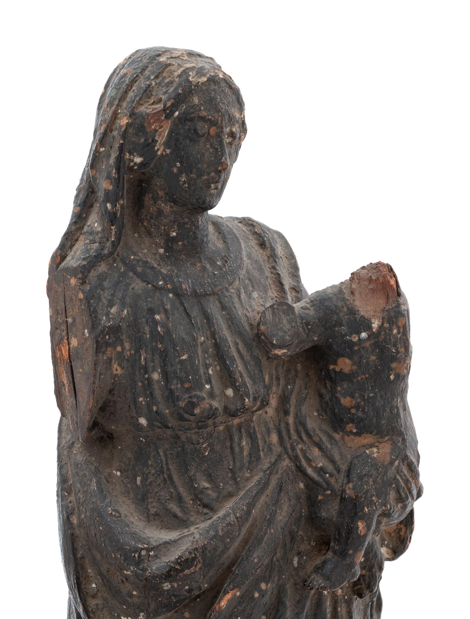 A Continental Carved Wood Figural Group Depicting the Madonna and Child