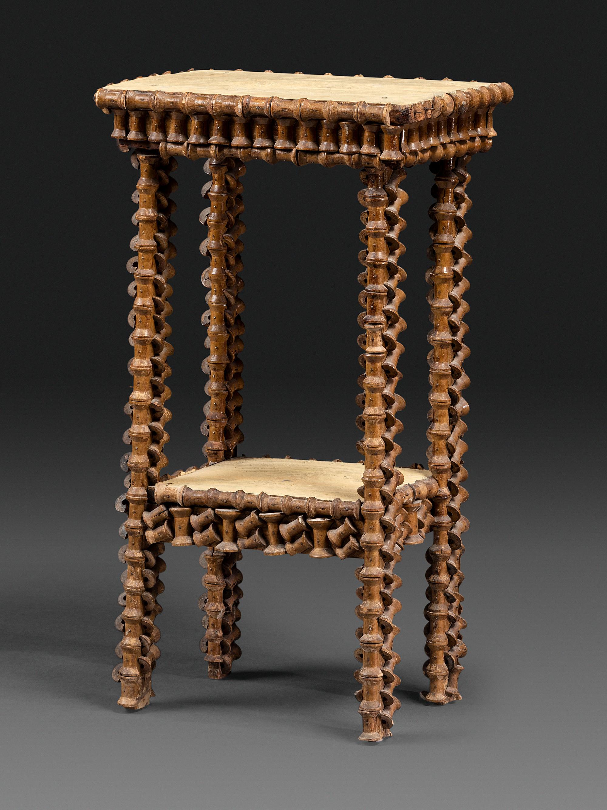 A Folk Art Wood Spool Decorated Pedestal Table