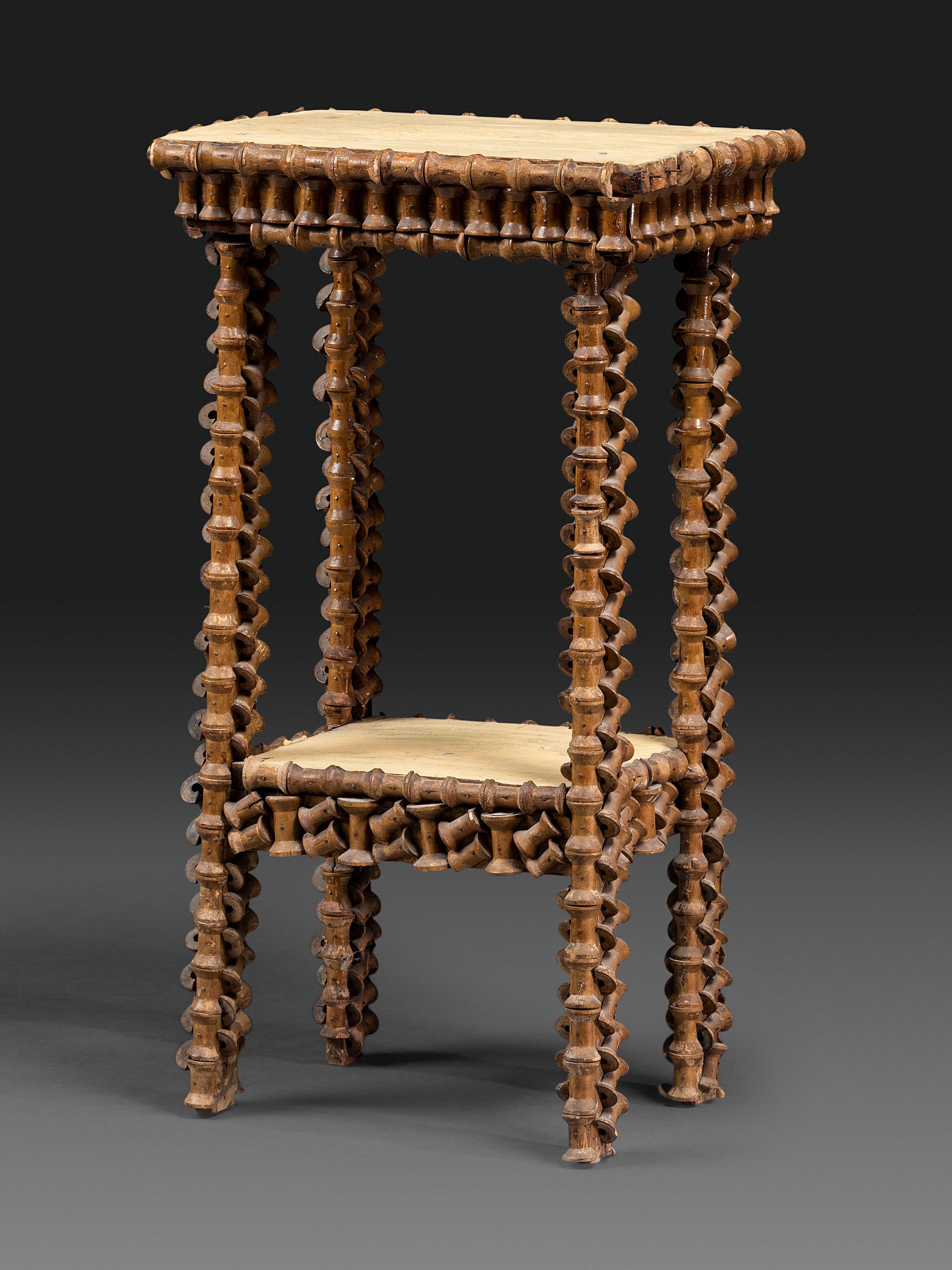 A Folk Art Wood Spool Decorated Pedestal Table