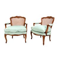 A Pair of French Provincial Louis XV Style Cane-Back Fauteuils — 20TH CENTURY