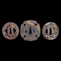 A group of three Japanese gold-inlaid iron tsuba, one signed 日本嵌金刀镡一组三件 一件带签字 Edo to early Meiji period ?????