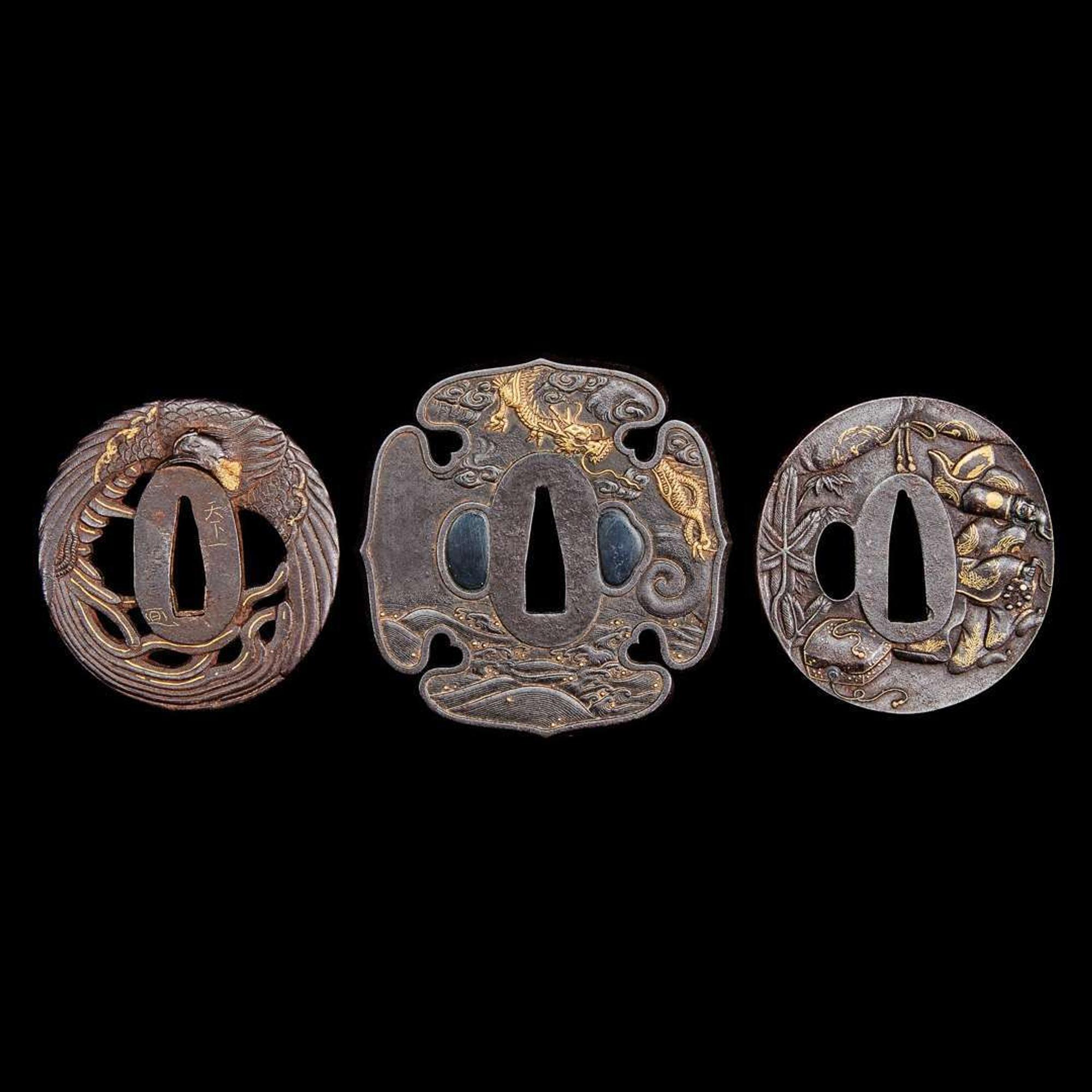 A group of three Japanese gold-inlaid iron tsuba, one signed 日本嵌金刀镡一组三件 一件带签字 Edo to early Meiji period ?????