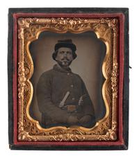 [CIVIL WAR]. Ninth plate tintype portrait of a doubly armed federal soldier.