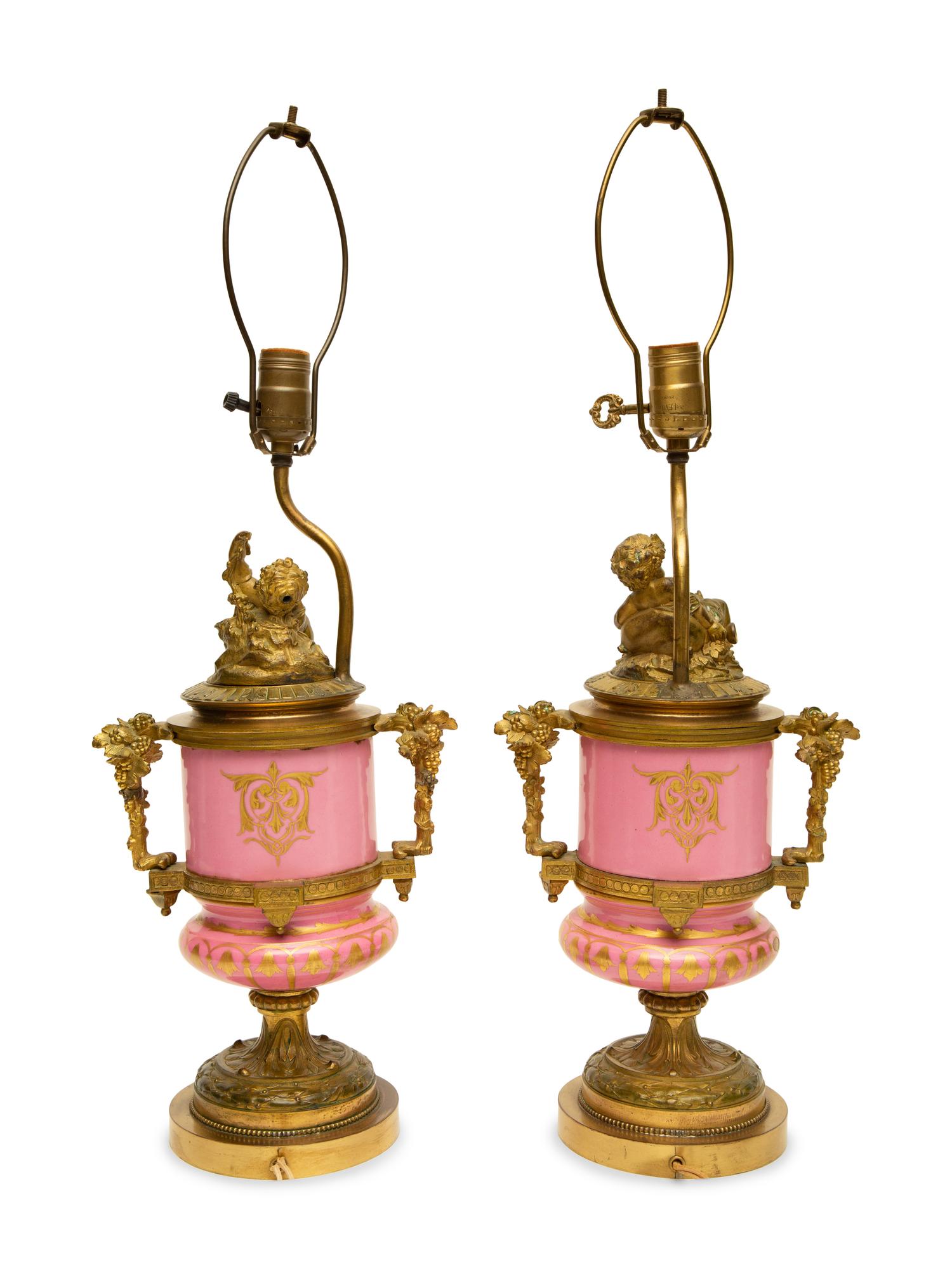 A Pair of Gilt Bronze Mounted Sèvres Style Porcelain Urns Mounted as Lamps