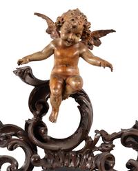 A Venetian Carved Walnut Mirror