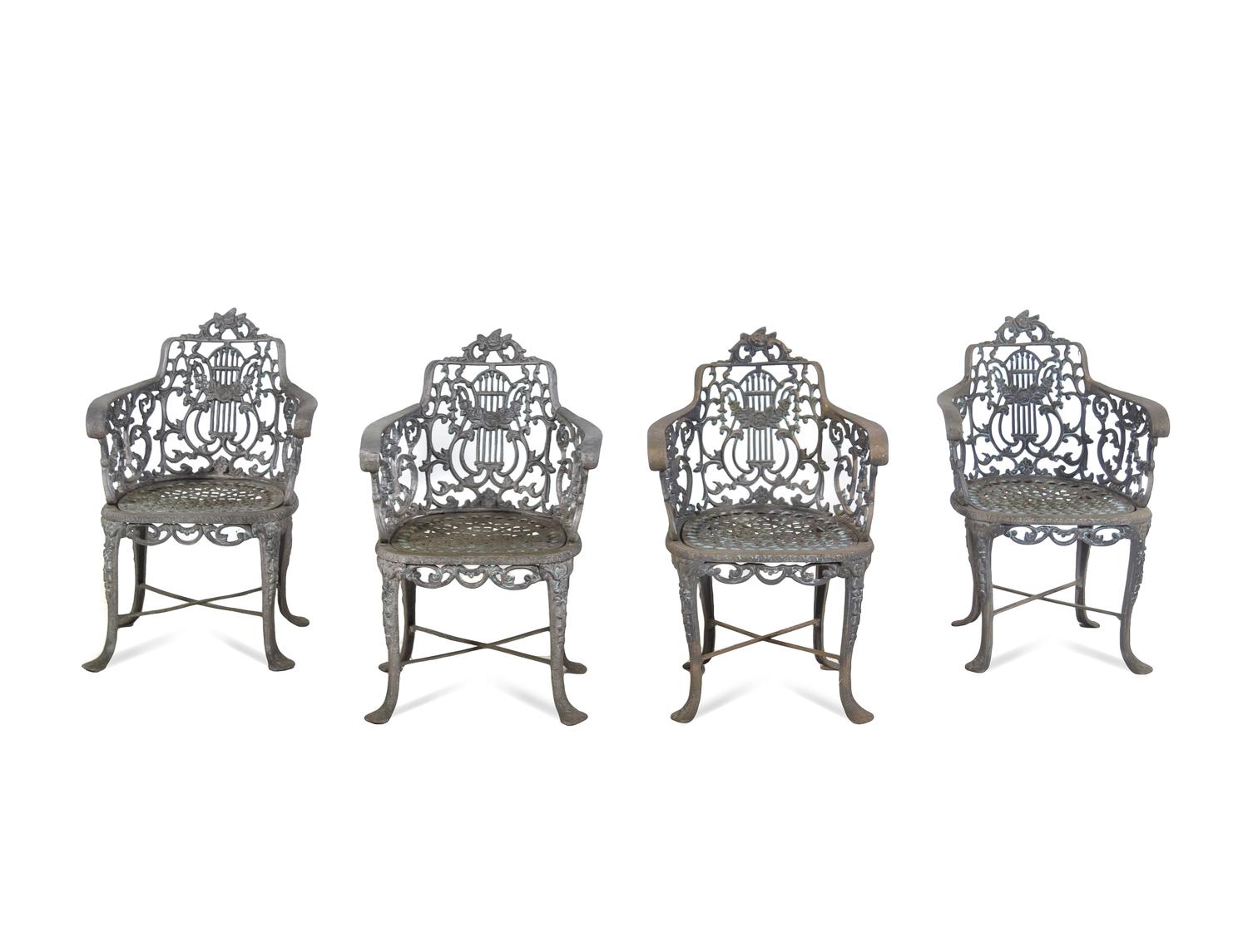 A Set of Three Victorian Style Cast Iron Garden Tables with Twelve Chairs