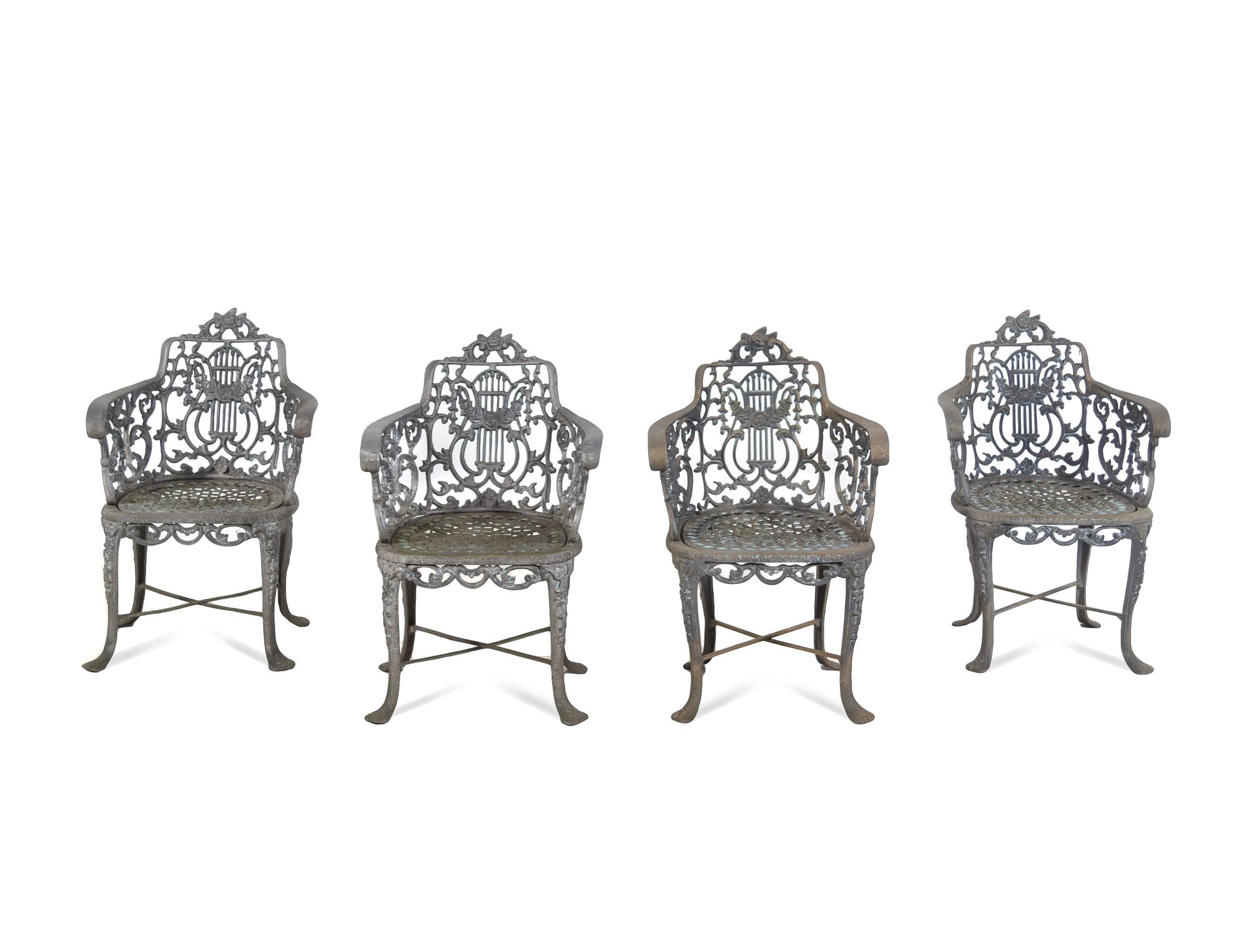 A Set of Three Victorian Style Cast Iron Garden Tables with Twelve Chairs
