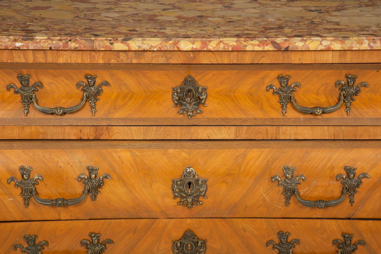 A Régence Style Gilt Metal Mounted Breche d'Alep Marble Top Commode