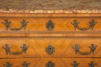 A Régence Style Gilt Metal Mounted Breche d'Alep Marble Top Commode