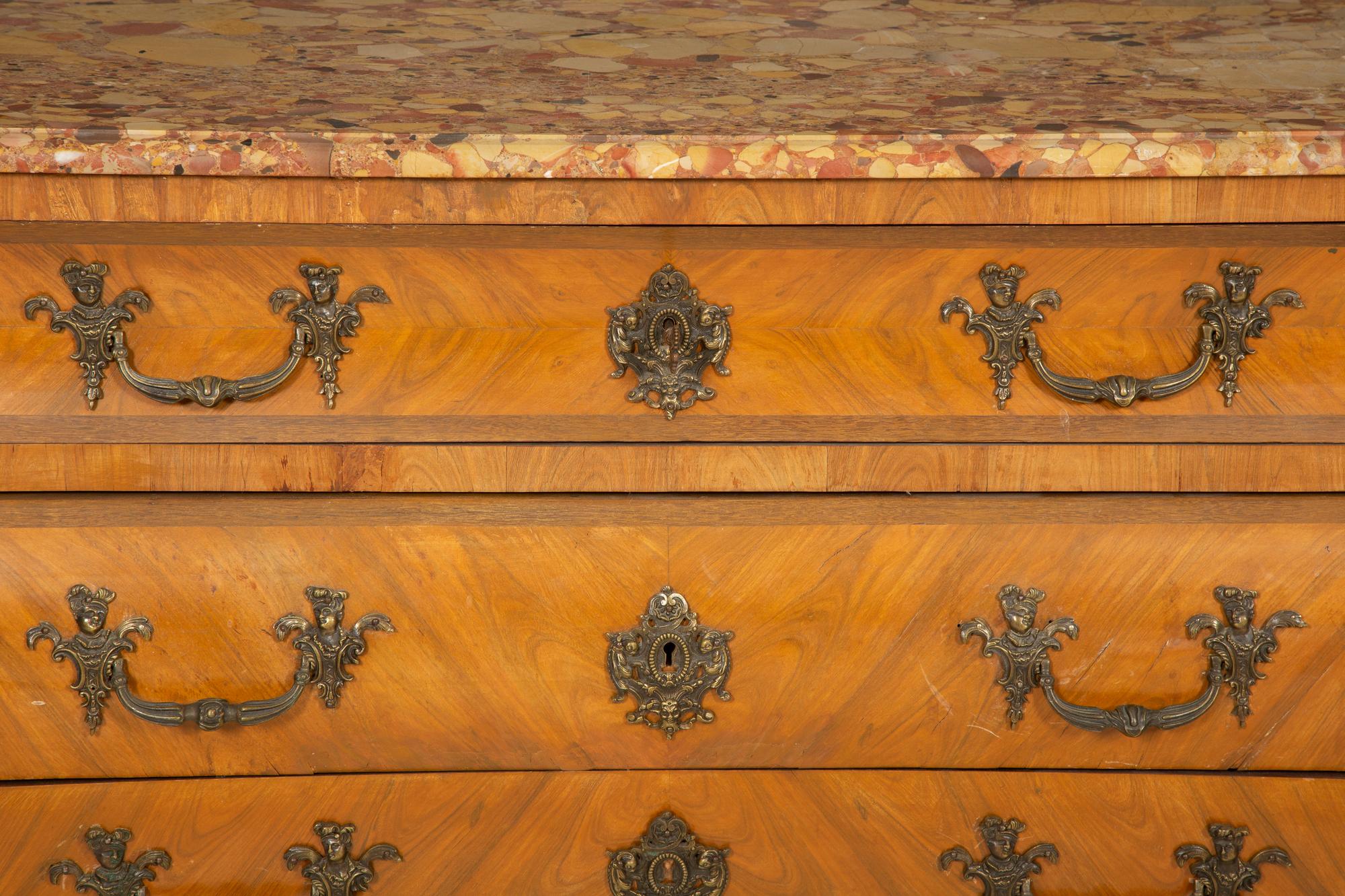 A Régence Style Gilt Metal Mounted Breche d'Alep Marble Top Commode