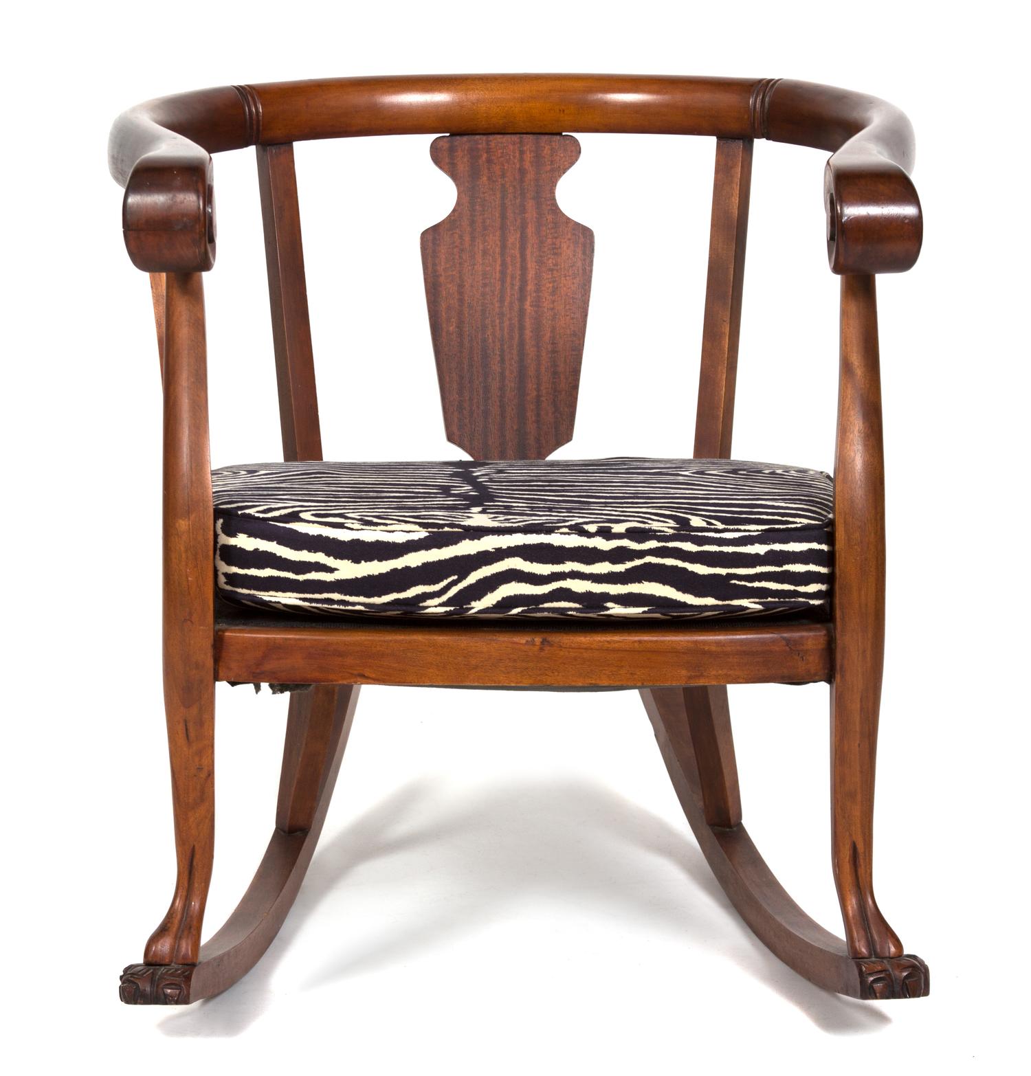 A British Colonial Mahogany Loveseat and Barrel-Back Rocking Chair Height of loveseat 32 x width 45 x depth 23 inches. — 20TH CENTURY